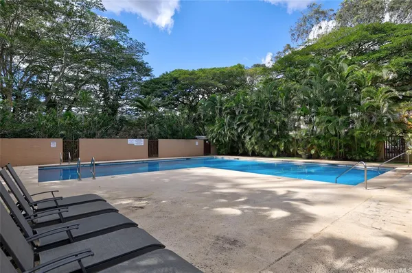 a view of a swimming pool with a patio