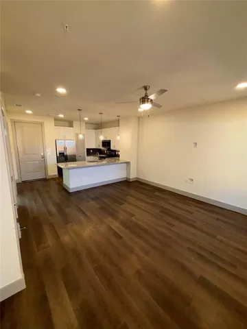 a view of kitchen with wooden floor