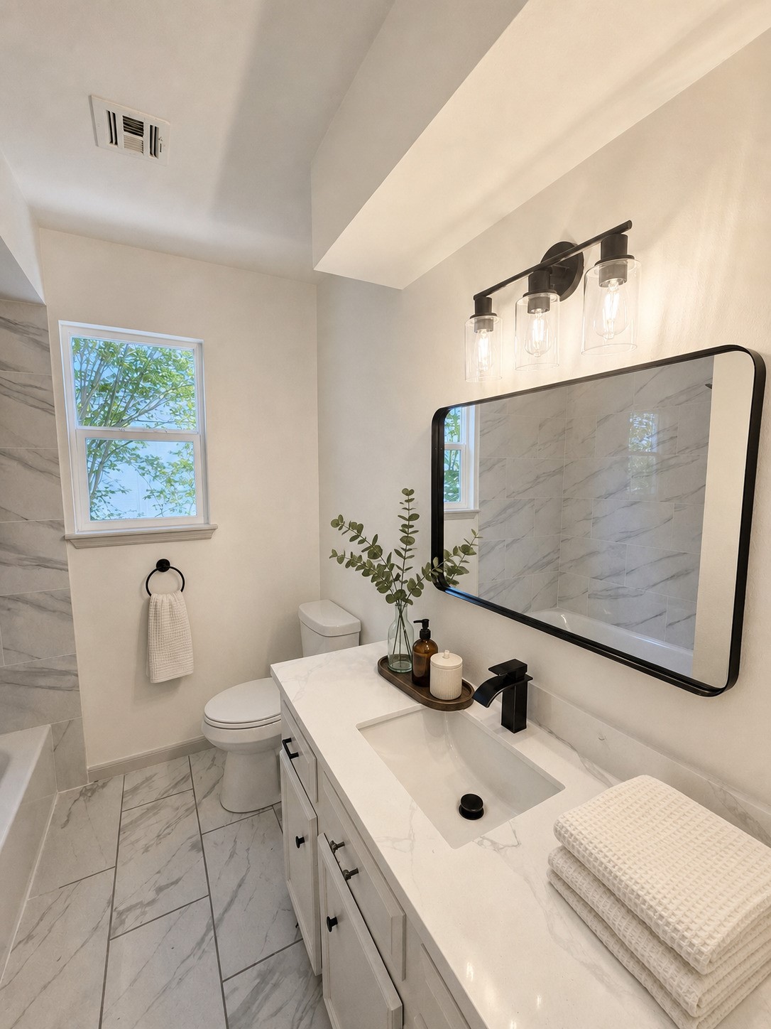 306 Houghton Road Katy, TX 77450 - Photo 15 of 34 Updated bathroom with vanity, mirror, and tub/shower combination. Virtually Staged
