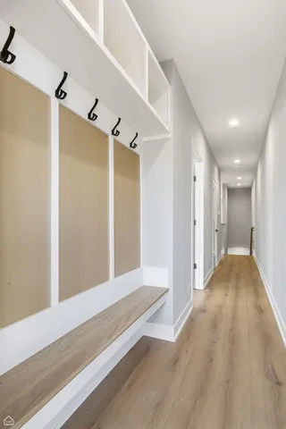 a view of hallway with wooden floor