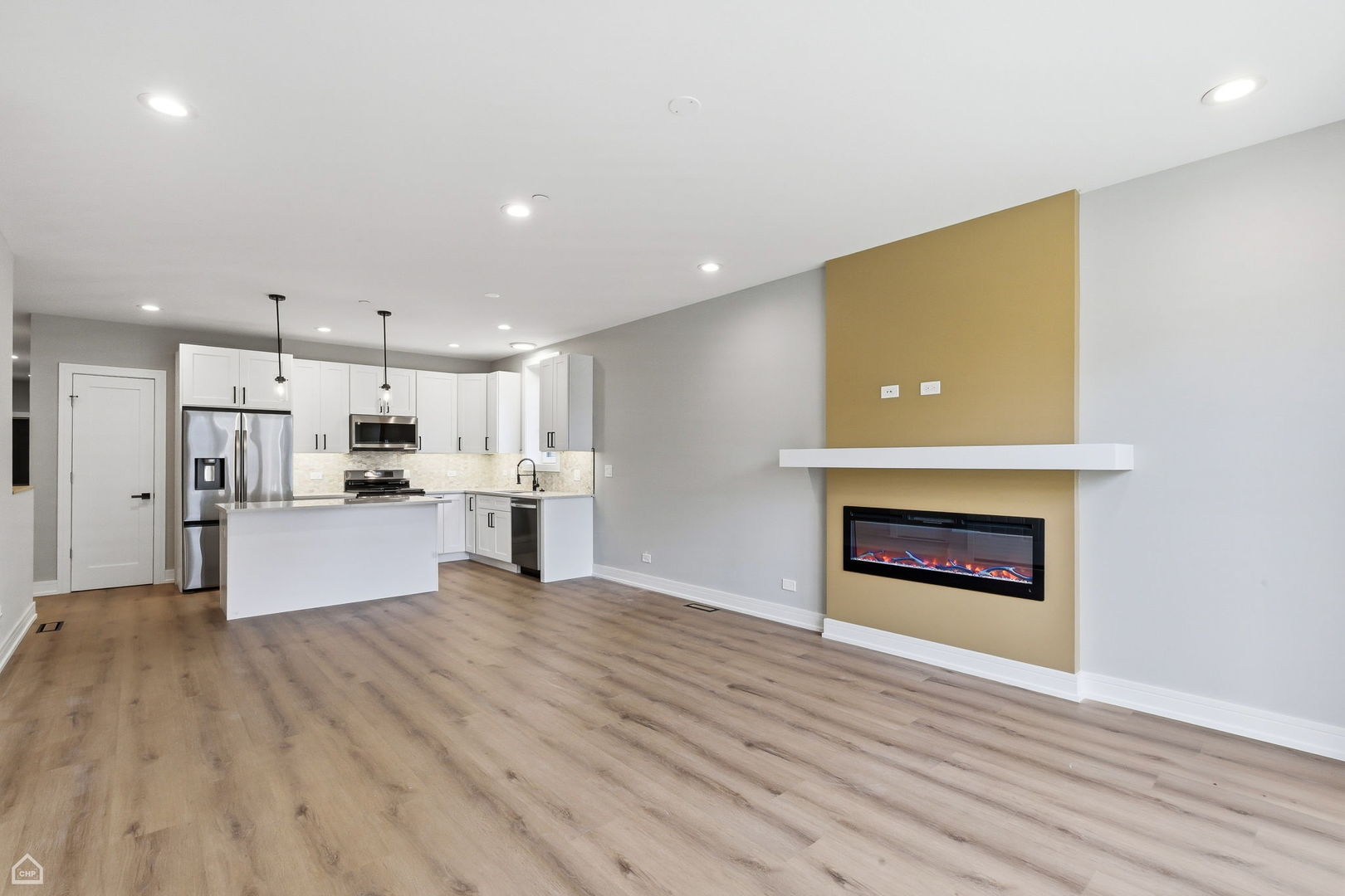 2718 Budd Street, Unit 2N River Grove, IL 60171 - Photo 2 of 48 a view of kitchen with kitchen island wooden floor center island and stainless steel appliances