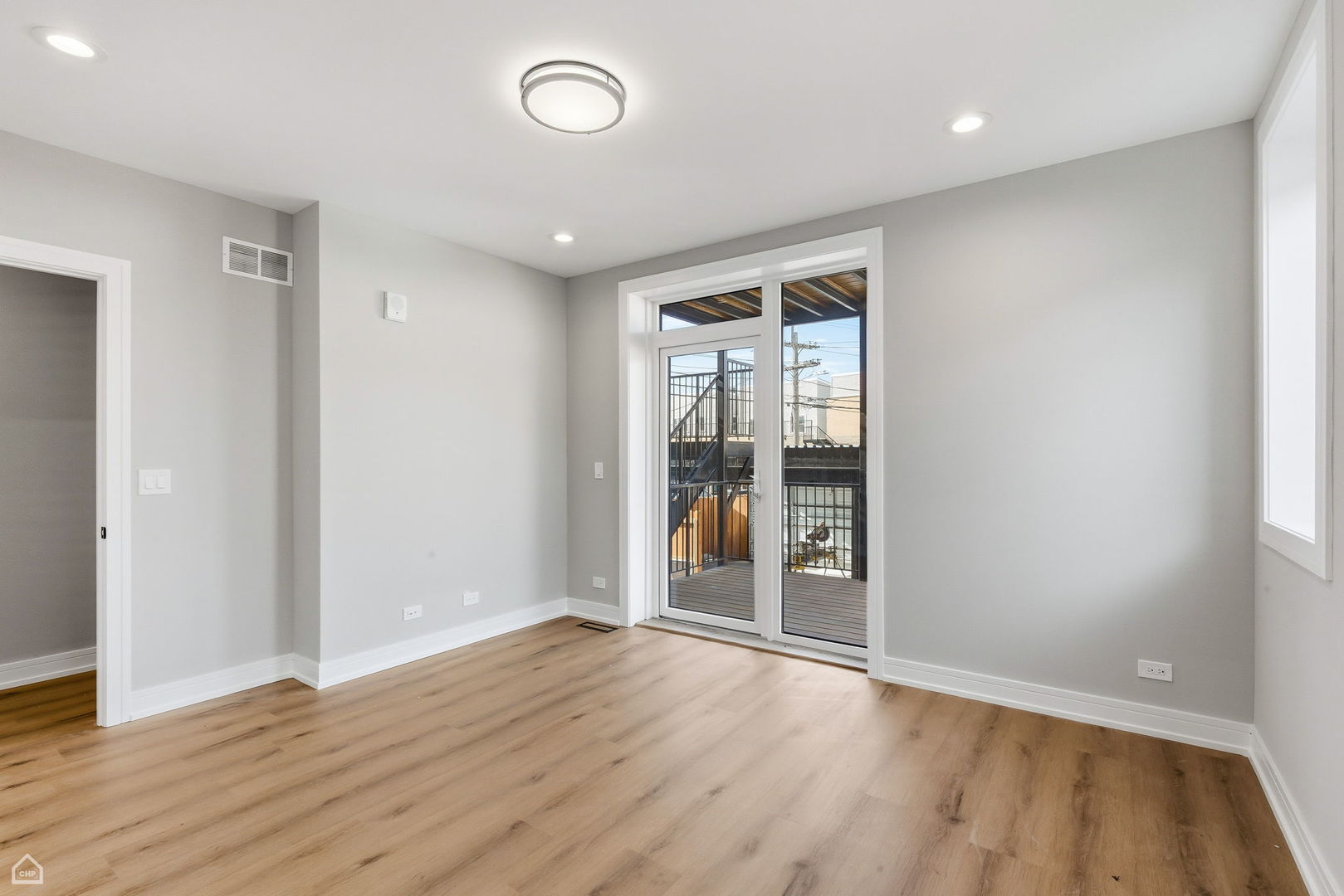2718 Budd Street, Unit 2N River Grove, IL 60171 - Photo 25 of 48 wooden floor in an empty room with a window