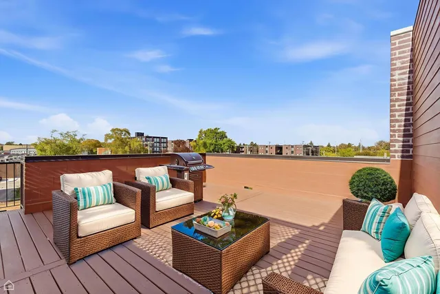 a balcony with furniture and city view