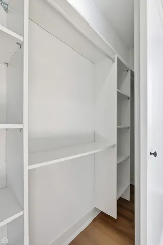 a bathroom with a double vanity sink toilet and shower