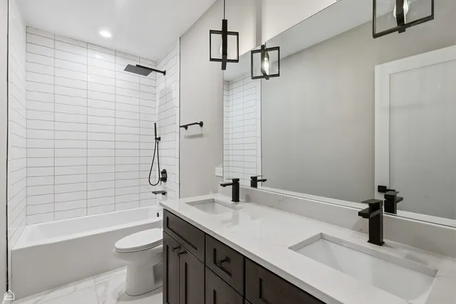 a bathroom with a tub sink and vanity