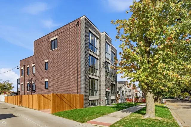 a view of a building with a yard