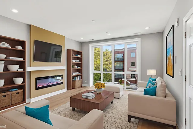 a living room with furniture fireplace and window