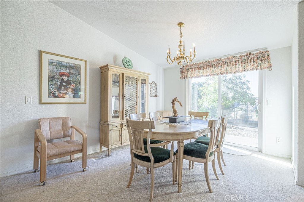 29520 Piani Road Pearblossom, CA 93553 - Photo 13 of 40 a view of a dining room with furniture window and outside view
