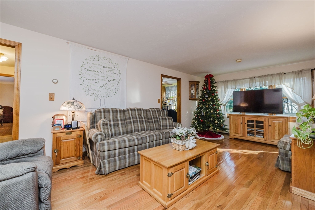 36 Indian Run Road Bellingham, MA 02019 - Photo 14 of 33 a living room with a flat screen tv and a couch