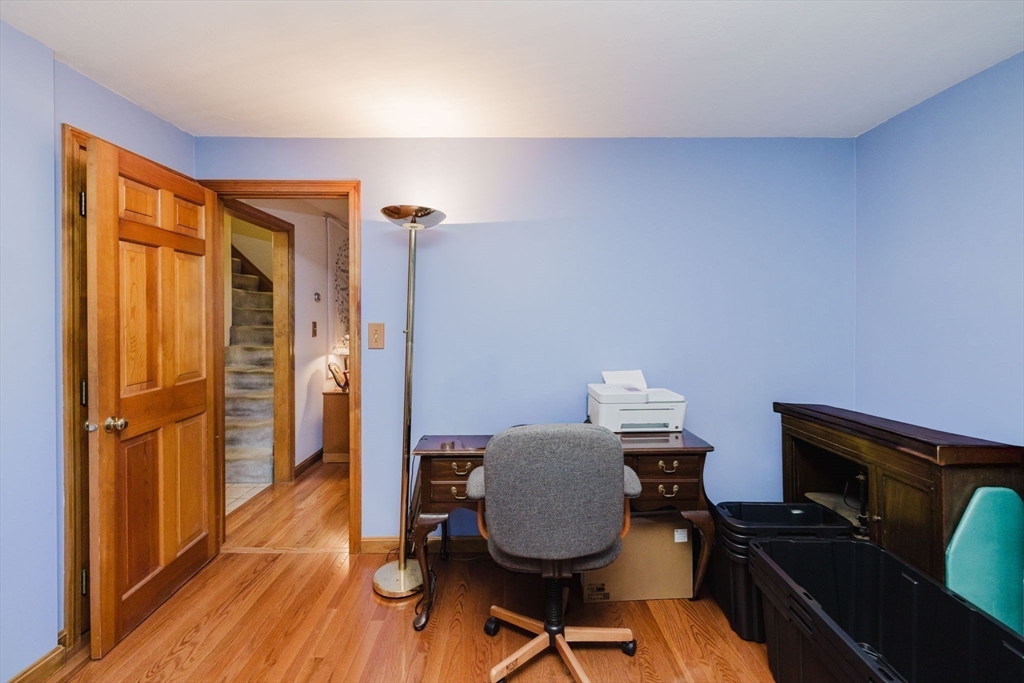 36 Indian Run Road Bellingham, MA 02019 - Photo 15 of 33 a view of a workspace with furniture and wooden floor