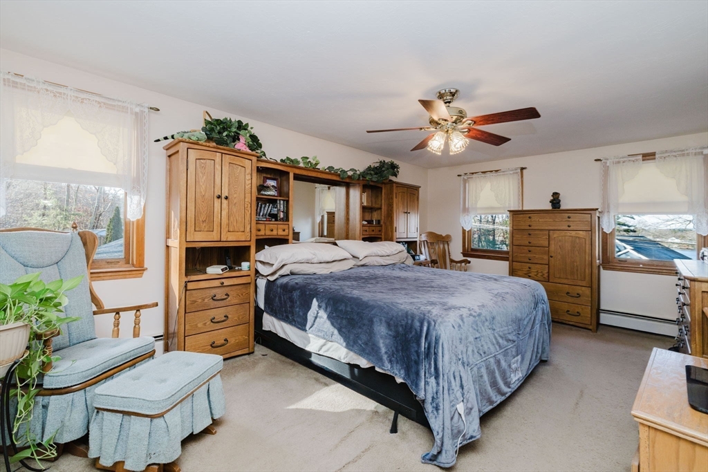36 Indian Run Road Bellingham, MA 02019 - Photo 21 of 33 a bed room with a bed and a chair