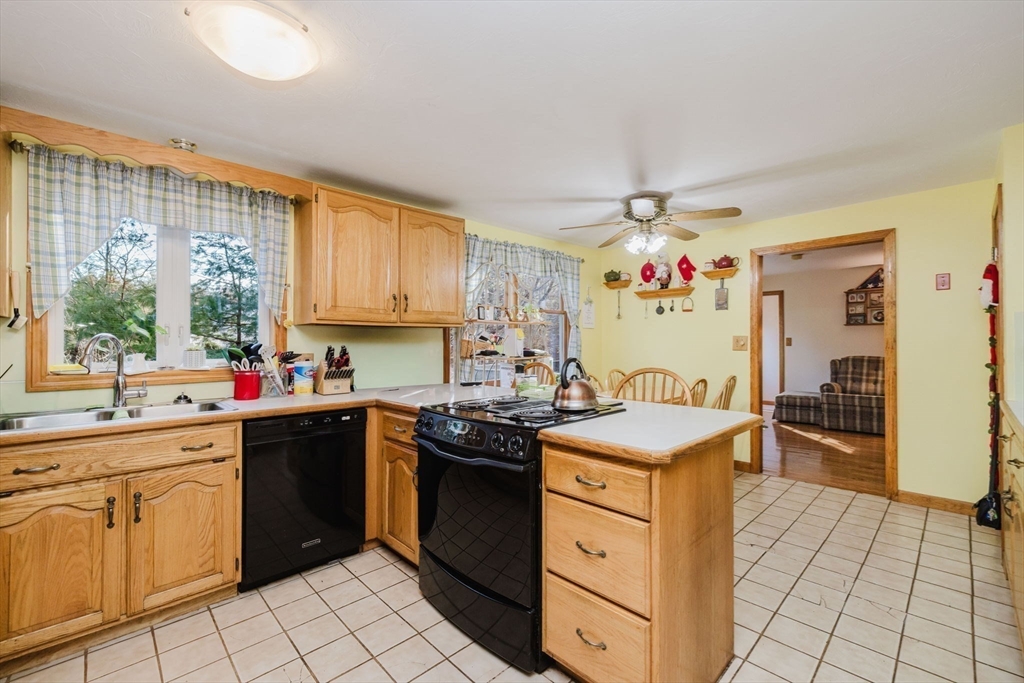 36 Indian Run Road Bellingham, MA 02019 - Photo 4 of 25 a kitchen that has a sink and a stove in it