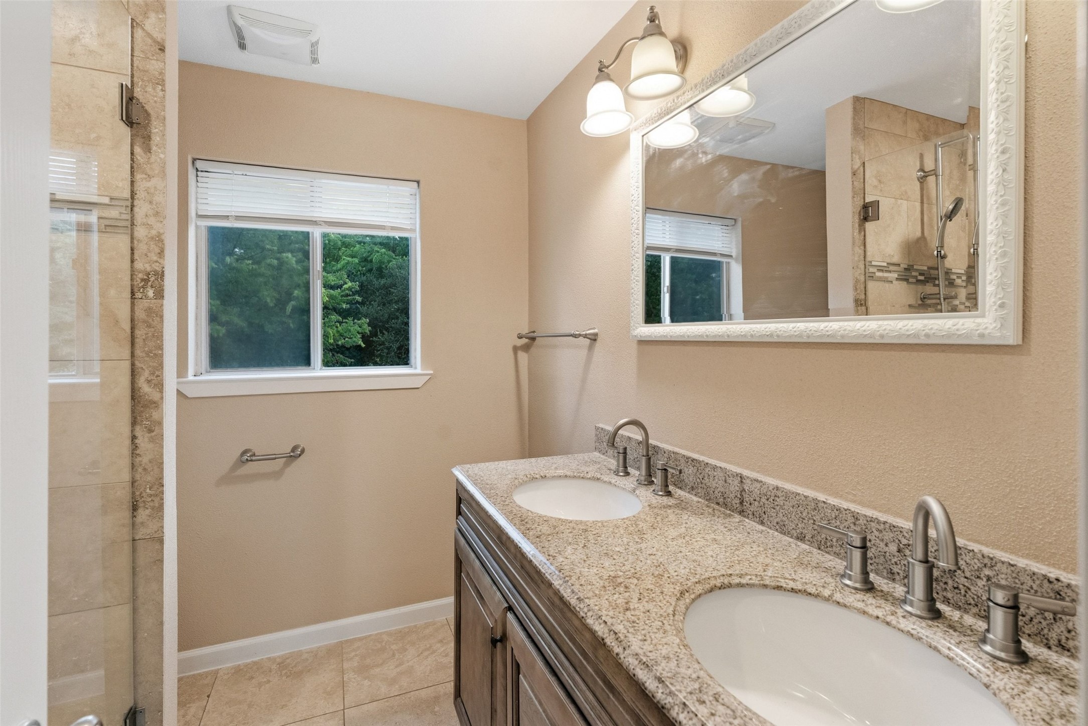 702 Castle Ridge Road, Unit C Austin, TX 78746 - Photo 15 of 36 A full bathroom serves both bedrooms