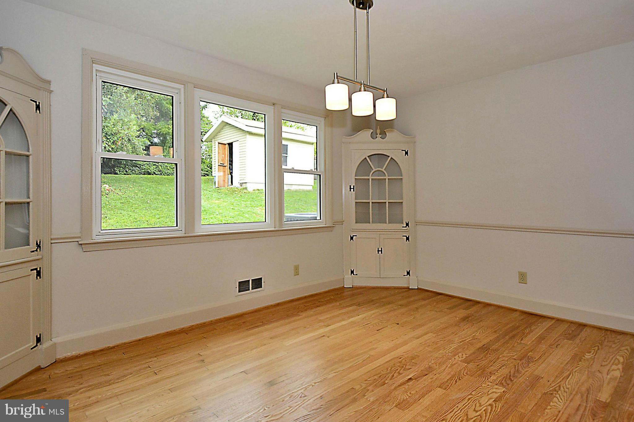 1311 Glendale Road Baltimore, MD 21239 - Photo 12 of 30 Dining Room with Picture Window to Back Yard