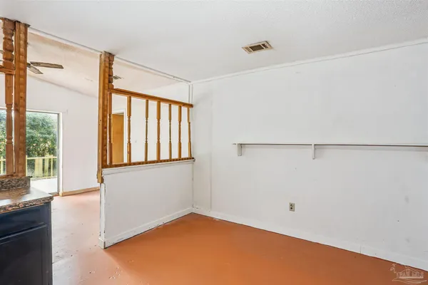 a view of an empty room with a window