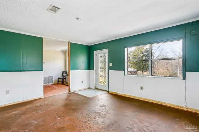 a view of livingroom with furniture and window