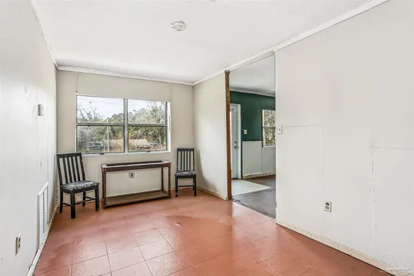 an empty room with windows and closet