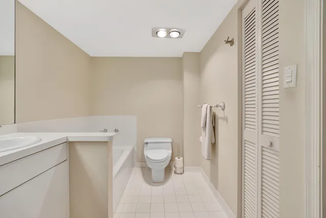 a bathroom with a double vanity sink mirror and double