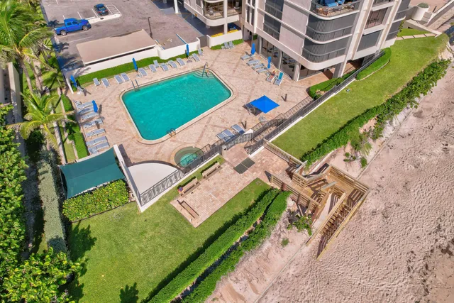 a front view of a building with a yard