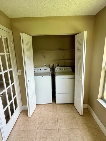 an empty room with a empty space and a window