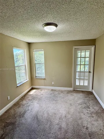 a bathroom with a sink mirror toilet and bathtub