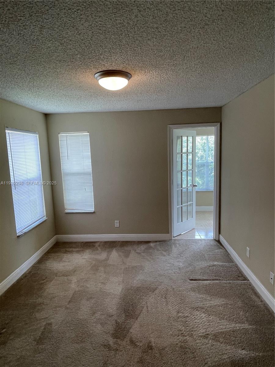 595 Vista Isles Drive, Unit 1923 Sunrise, FL 33325 - Photo 16 of 18 an empty room with windows