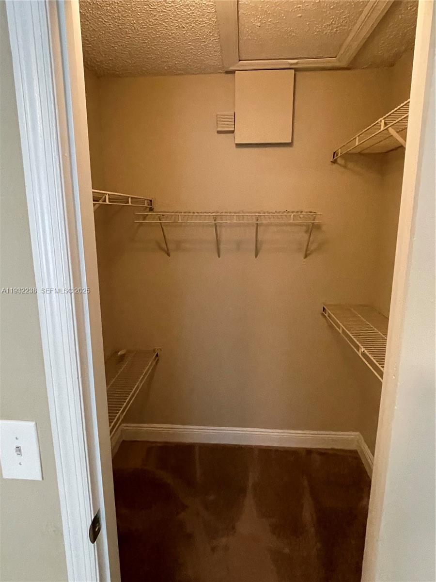 595 Vista Isles Drive, Unit 1923 Sunrise, FL 33325 - Photo 18 of 18 a view of small space with racks on the wall