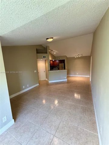 an empty room with windows and view