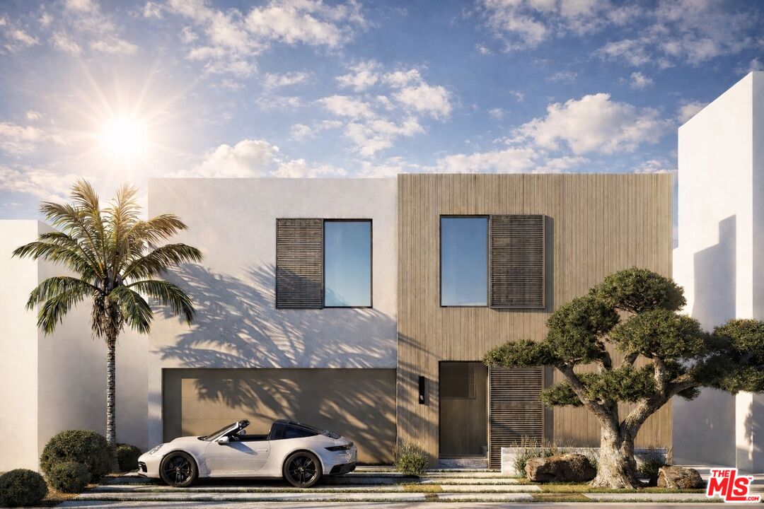 a front view of a house with parking space