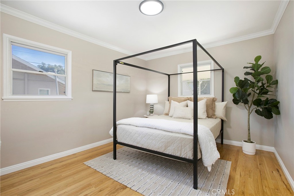 708 East Alder Street Brea, CA 92821 - Photo 17 of 34 a bedroom with a bed and a potted plant