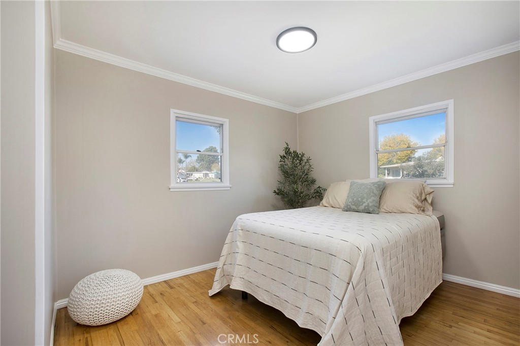 708 East Alder Street Brea, CA 92821 - Photo 19 of 34 a bedroom with a bed and wooden floor