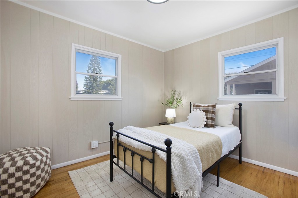 708 East Alder Street Brea, CA 92821 - Photo 21 of 34 a bedroom with a bed and wooden floor