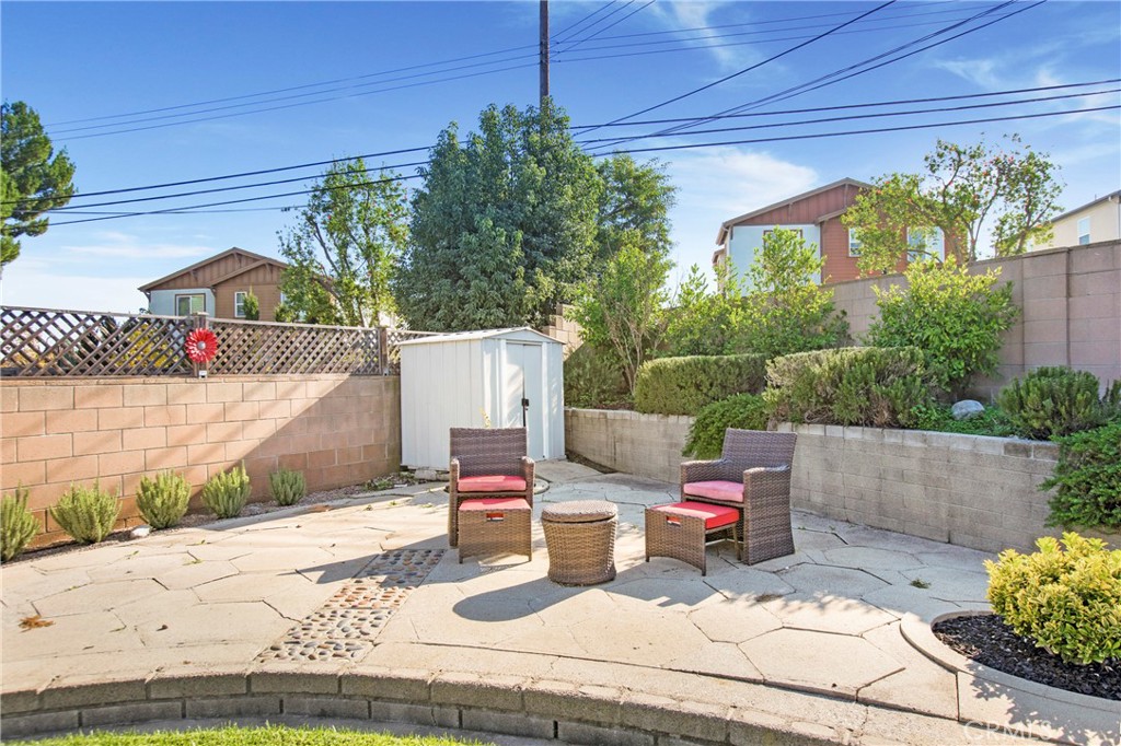 708 East Alder Street Brea, CA 92821 - Photo 26 of 34 a view of a patio with table and chairs potted plants