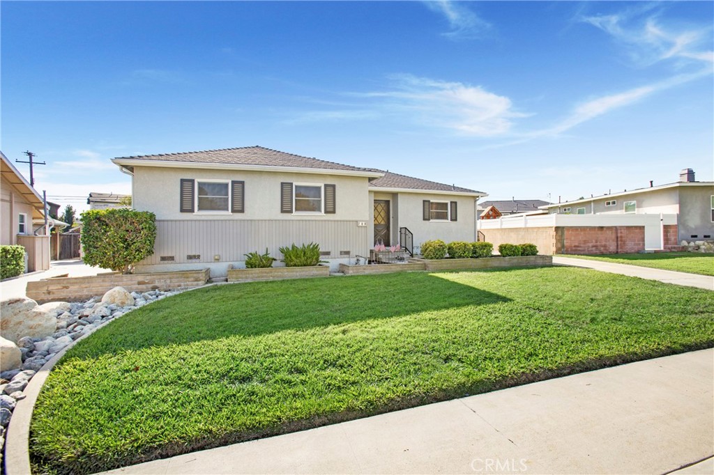 708 East Alder Street Brea, CA 92821 - Photo 34 of 34 a front view of a house with a garden and plants