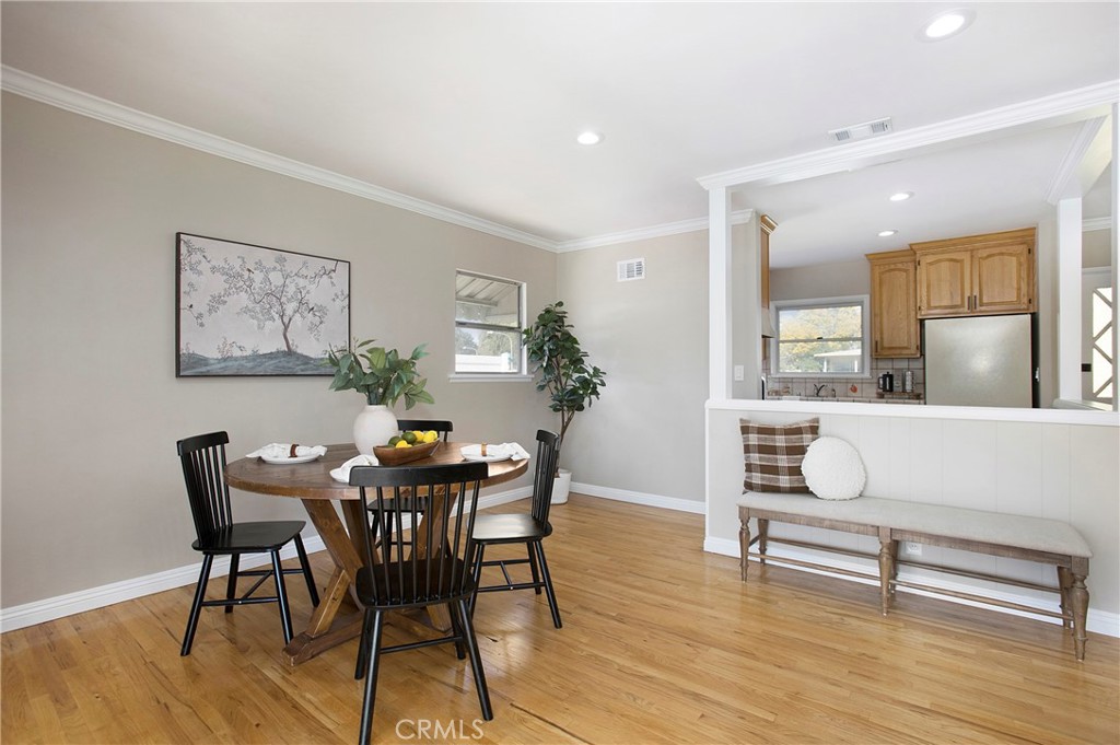708 East Alder Street Brea, CA 92821 - Photo 6 of 34 a view of a dining room with furniture and wooden floor
