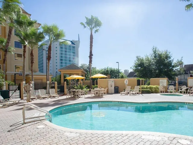 a view of a swimming pool with a patio