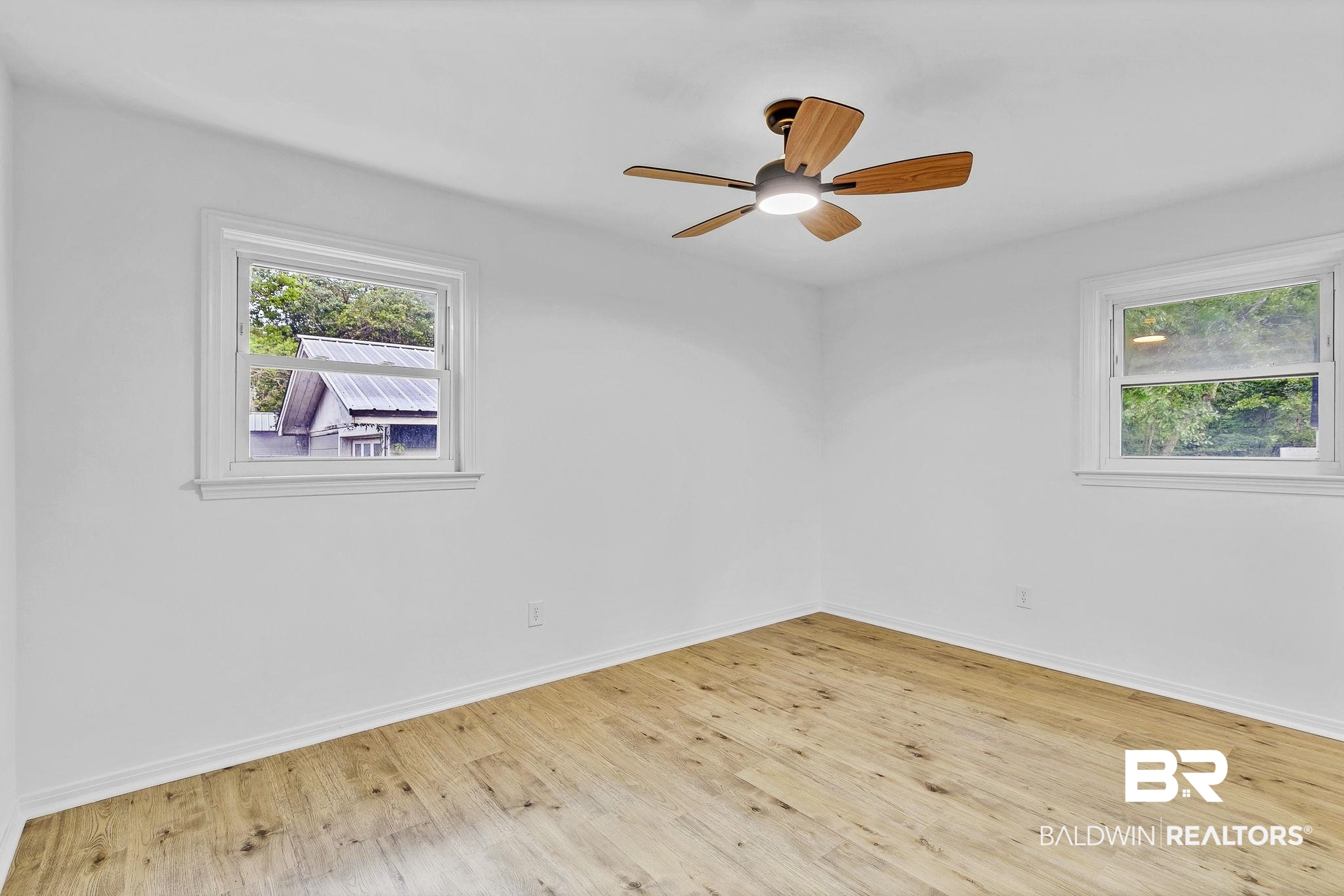 203 Anderson Road Saraland, AL 36571 - Photo 24 of 48 Unfurnished room with baseboards, ceiling fan, and wood finished floors