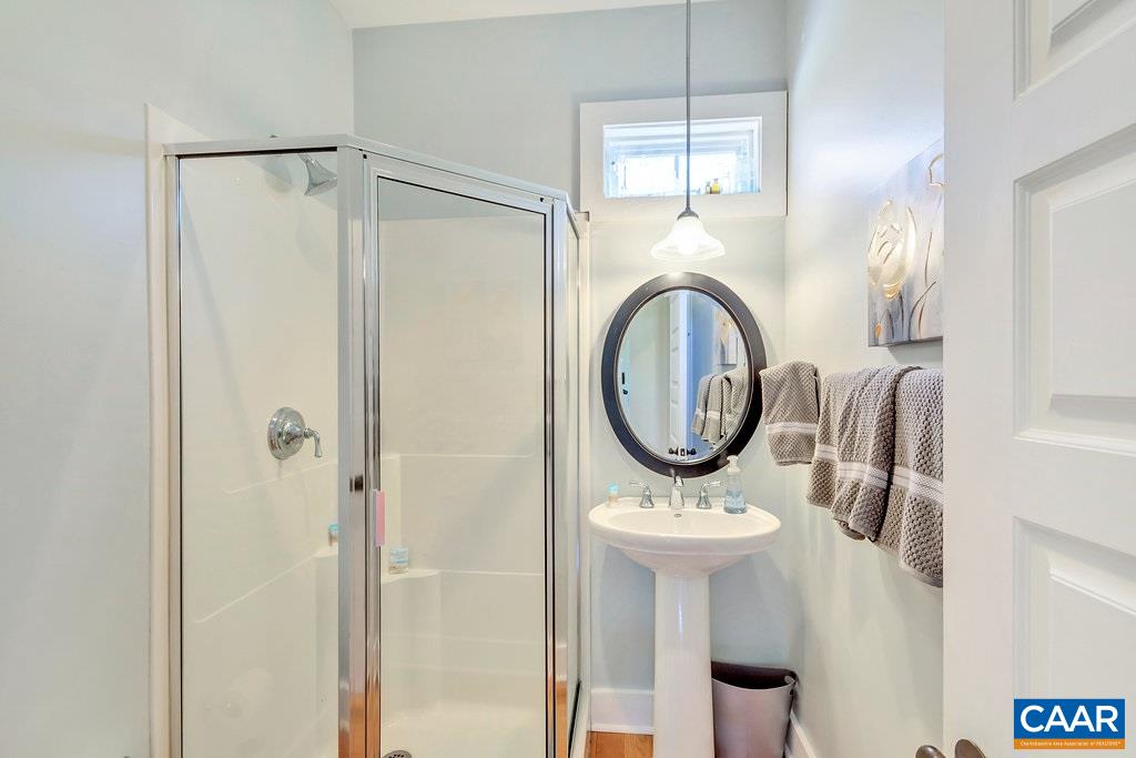 85 Fox Ridge Lane Ruckersville, VA 22968 - Photo 11 of 33 a bathroom with a sink a mirror a shower and a window