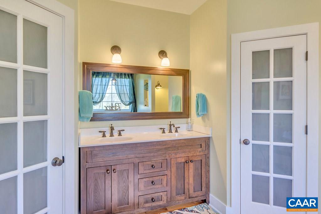 85 Fox Ridge Lane Ruckersville, VA 22968 - Photo 13 of 33 a bathroom with a sink and a mirror