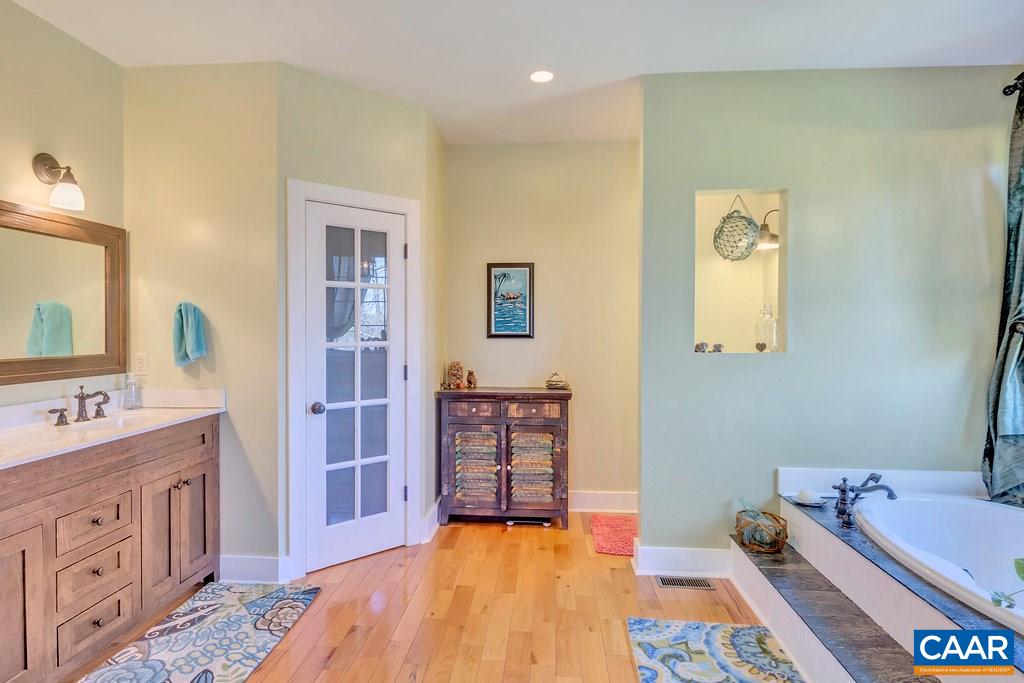 85 Fox Ridge Lane Ruckersville, VA 22968 - Photo 14 of 33 a spacious bedroom with a bed and a dresser in it