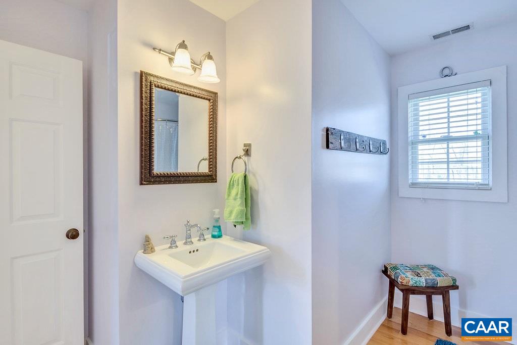 85 Fox Ridge Lane Ruckersville, VA 22968 - Photo 20 of 33 a bathroom with a sink a mirror and a window