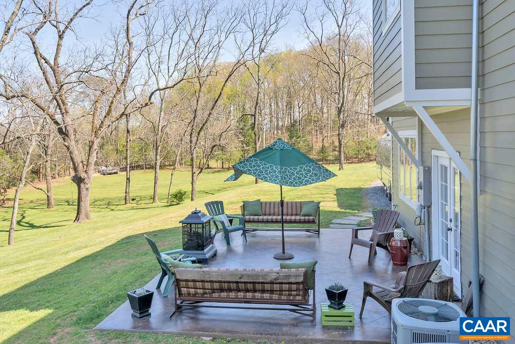 85 Fox Ridge Lane Ruckersville, VA 22968 - Photo 28 of 33 a view of a patio with couches table and chairs