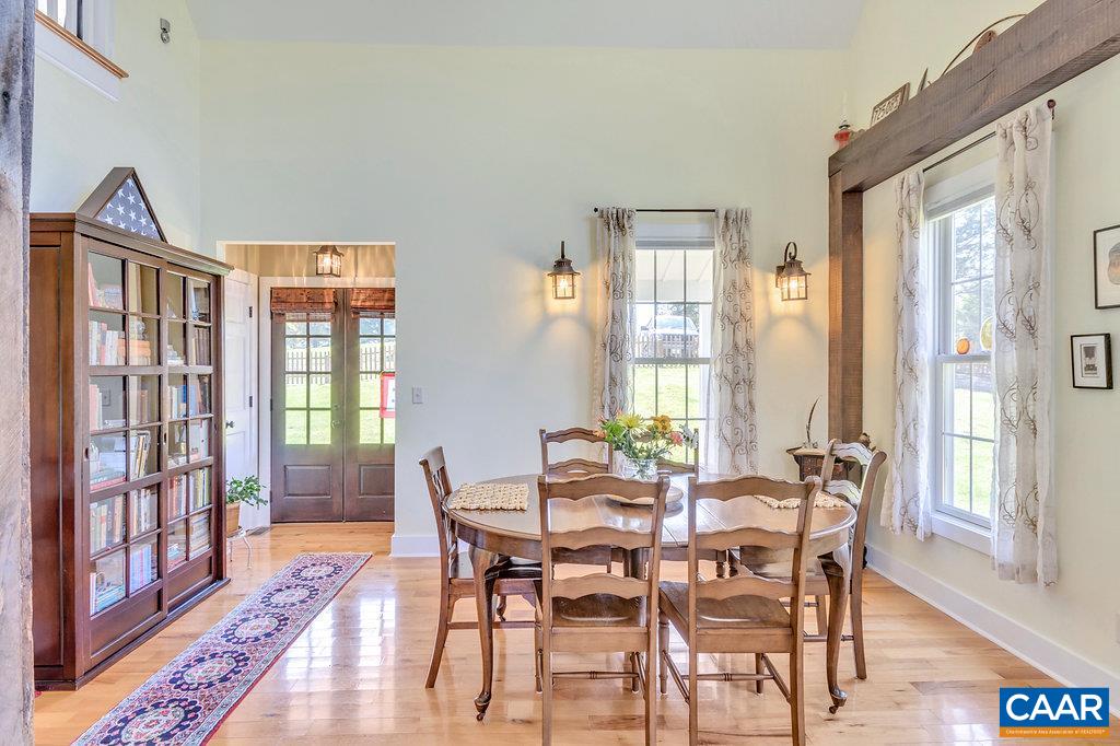 85 Fox Ridge Lane Ruckersville, VA 22968 - Photo 5 of 33 a view of a dining room with furniture window and wooden floor