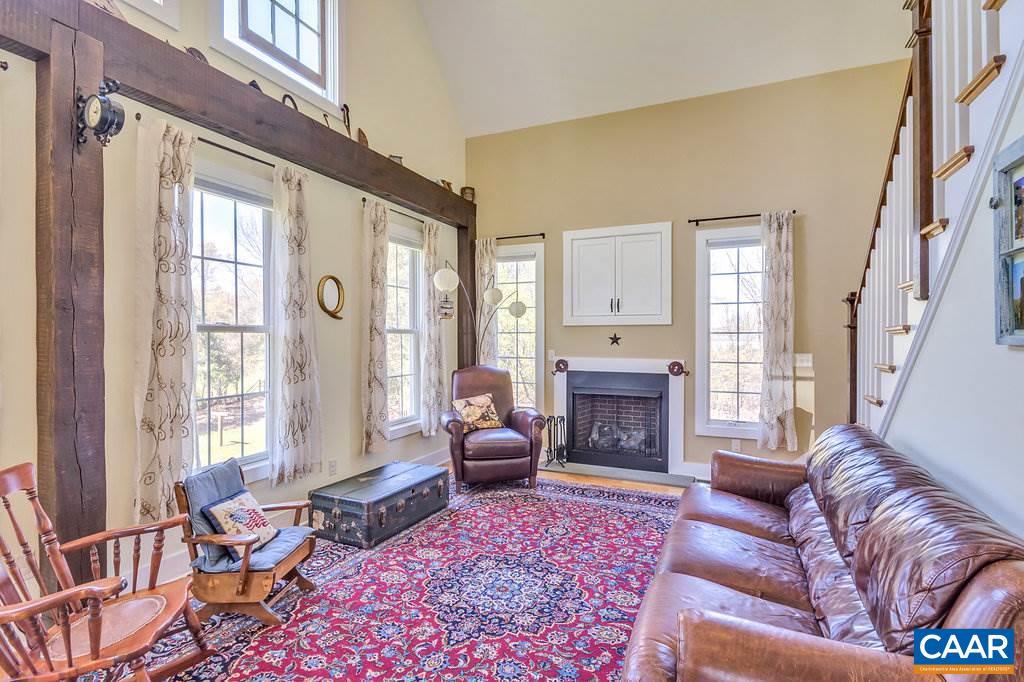 85 Fox Ridge Lane Ruckersville, VA 22968 - Photo 6 of 33 a living room with furniture fireplace and windows