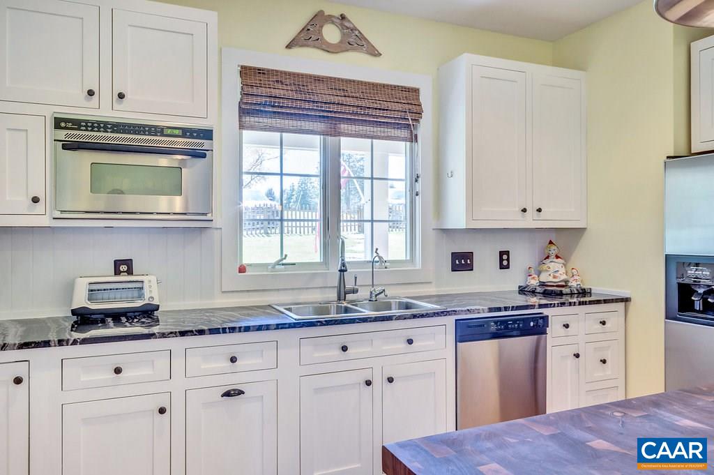 85 Fox Ridge Lane Ruckersville, VA 22968 - Photo 9 of 33 a kitchen with stainless steel appliances granite countertop a sink a stove and cabinets
