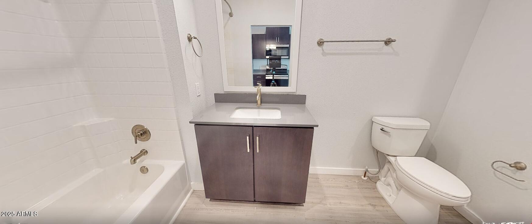 6025 West Thomas Road, Unit ST Phoenix, AZ 85033 - Photo 5 of 22 a bathroom with a sink a toilet and shower