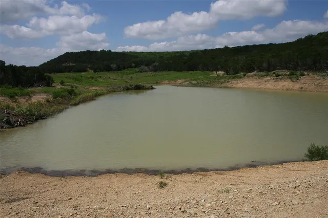 a view of a lake with mountain in the background