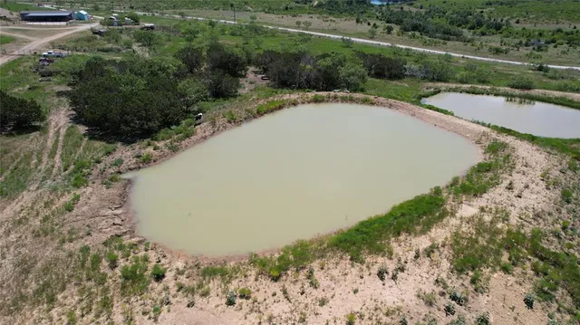 a view of a lake with a yard
