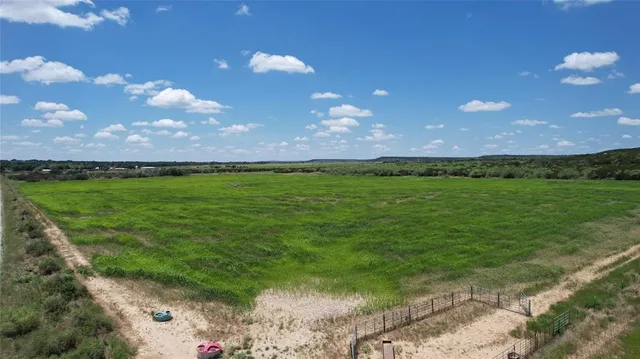 a view of an ocean and a yard