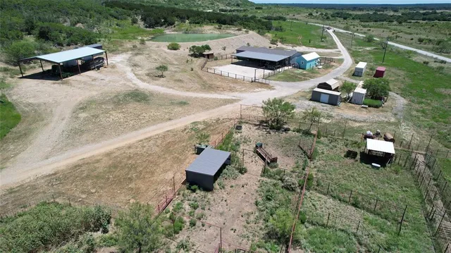 an aerial view of a house with outdoor space